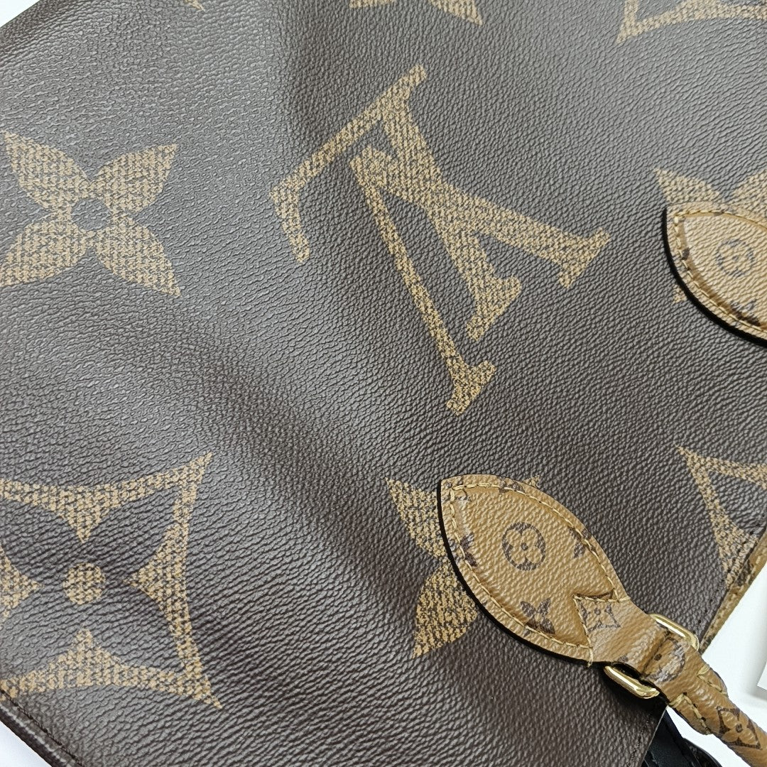 ONTHEGO MM Monogram Coated Canvas Brown
