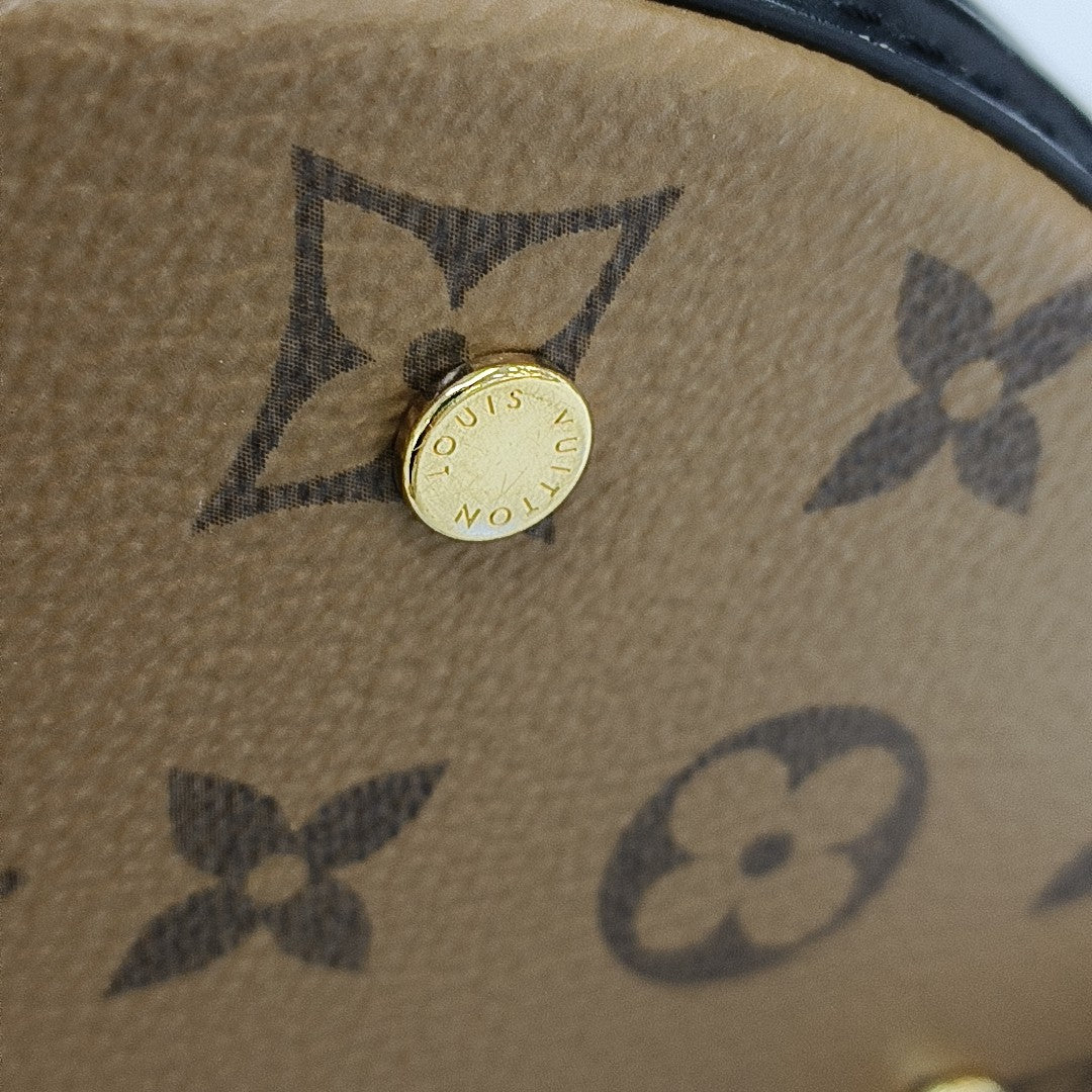 CANNES PM Monogram Coated Canvas Brown