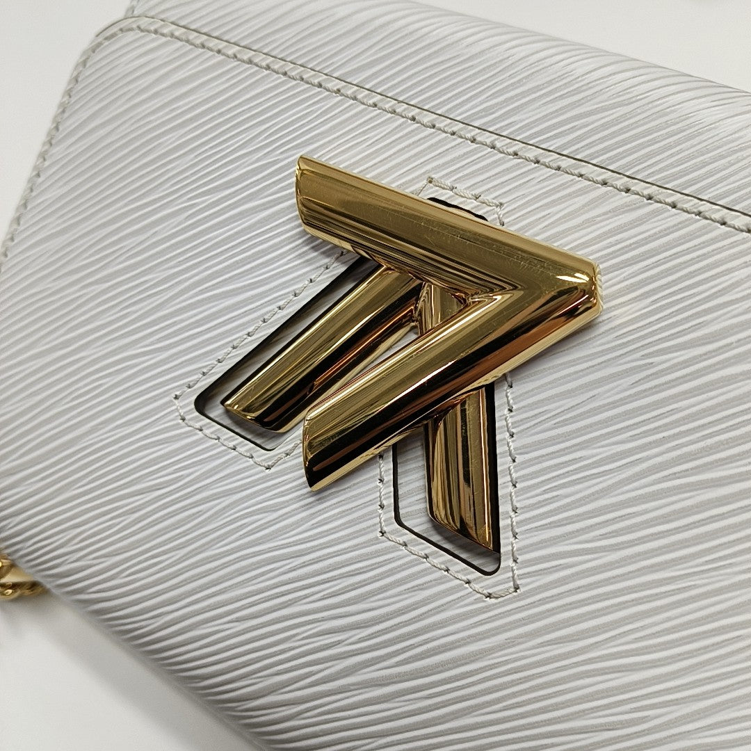 Authenticated pre-owned  TWIST PM Epi White - Shoulder Bag at Looply