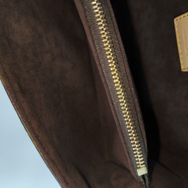 MÉTIS EAST WEST Monogram Coated Canvas Brown
