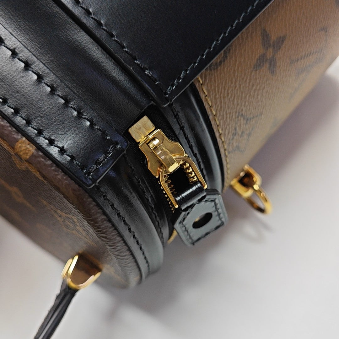 CANNES PM Monogram Coated Canvas Brown