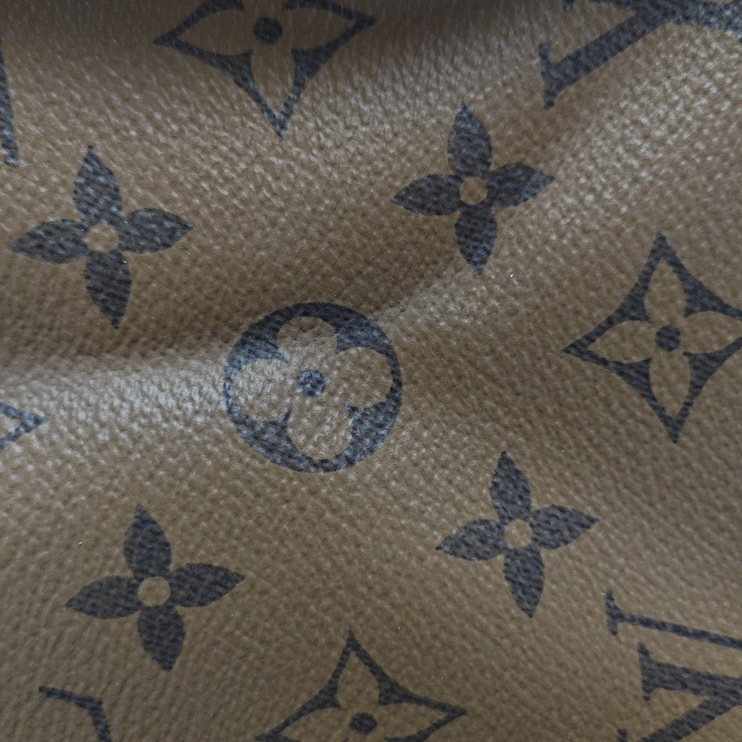 ONTHEGO MM Monogram Coated Canvas Brown
