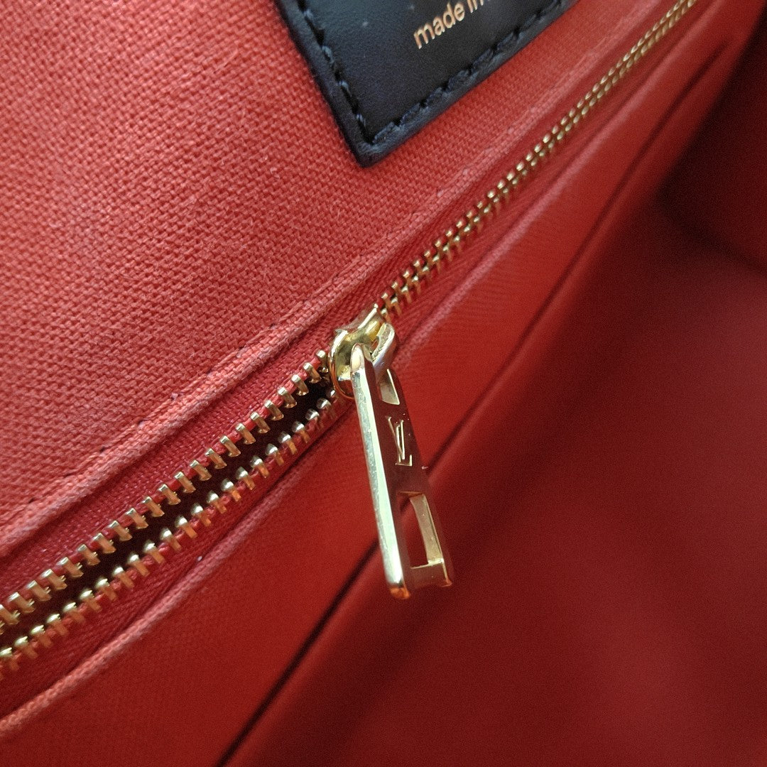 ONTHEGO MM Monogram Coated Canvas Brown