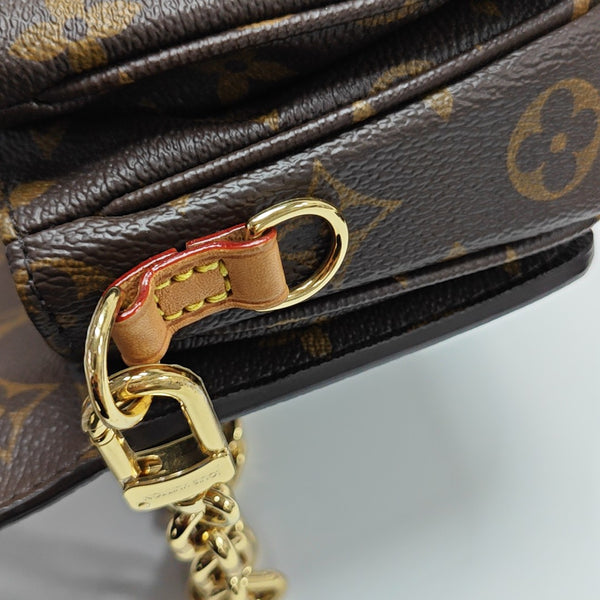 MÉTIS EAST WEST Monogram Coated Canvas Brown