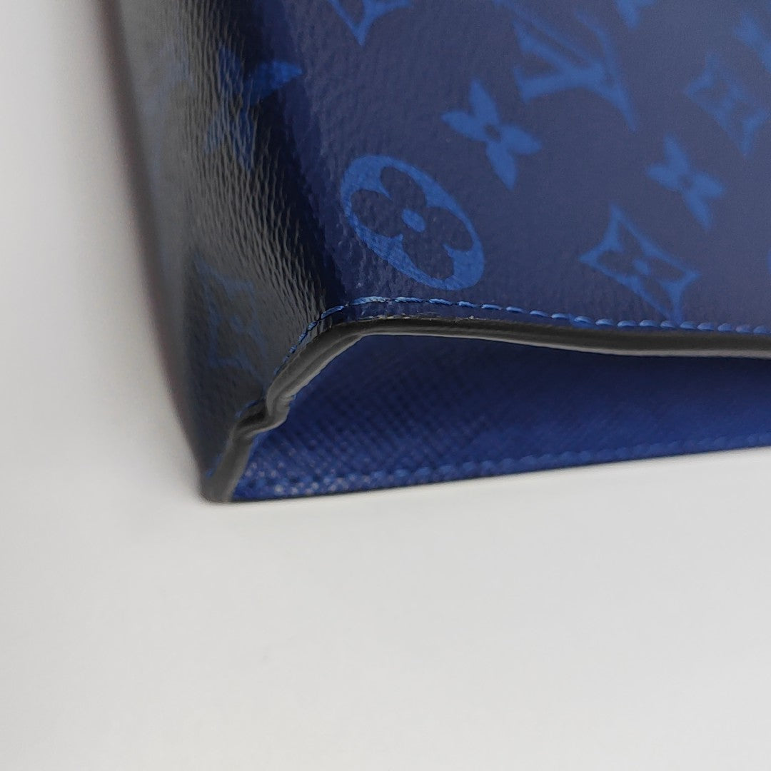 Pochette Voyag MM Monogram Coated Canvas Blue
