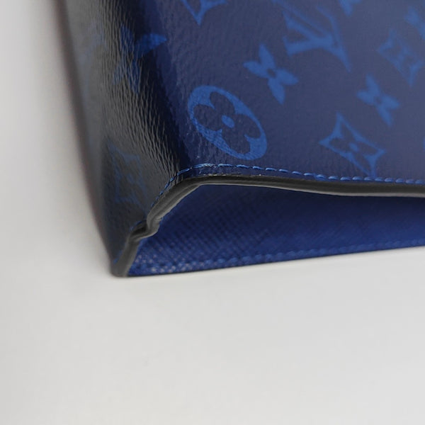 Pochette Voyag MM Monogram Coated Canvas Blue