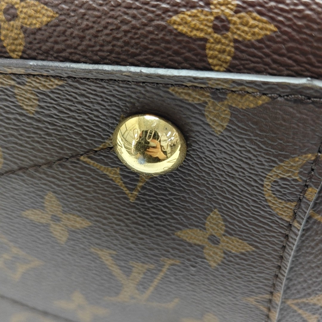 MONTAIGNE GM Monogram Coated Canvas Brown