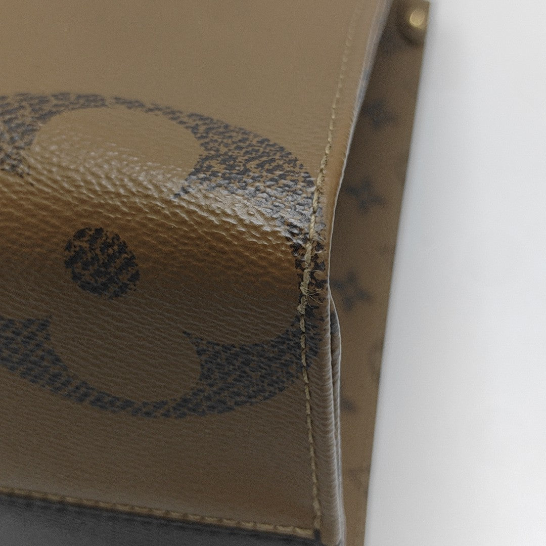ONTHEGO MM Monogram Coated Canvas Brown