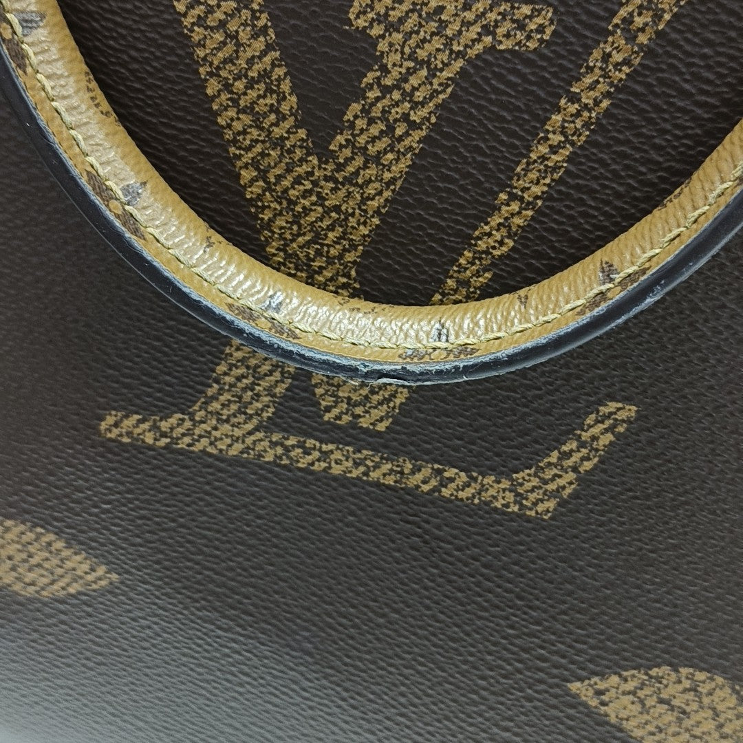 ONTHEGO MM Monogram Coated Canvas Brown