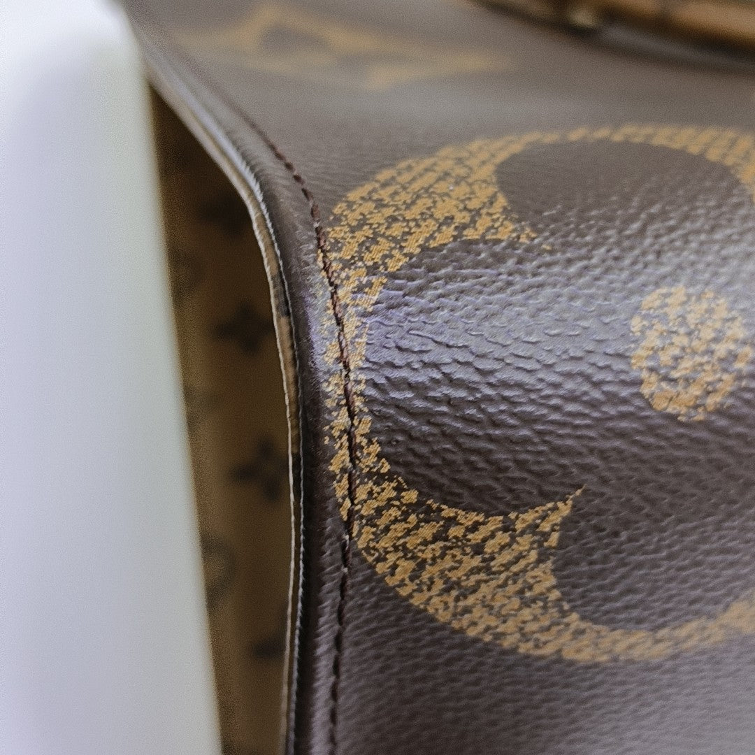 ONTHEGO MM Monogram Coated Canvas Brown