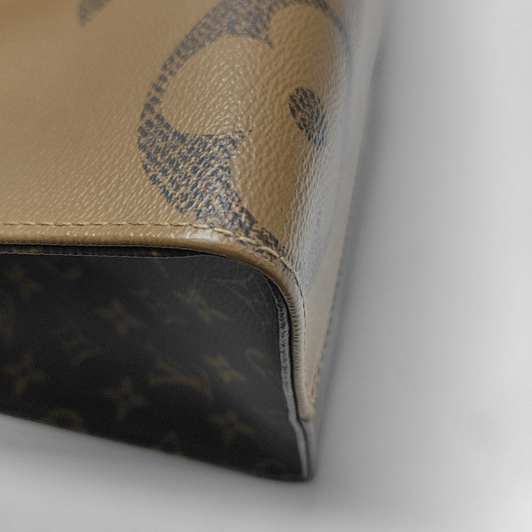 ONTHEGO MM Monogram Coated Canvas Brown