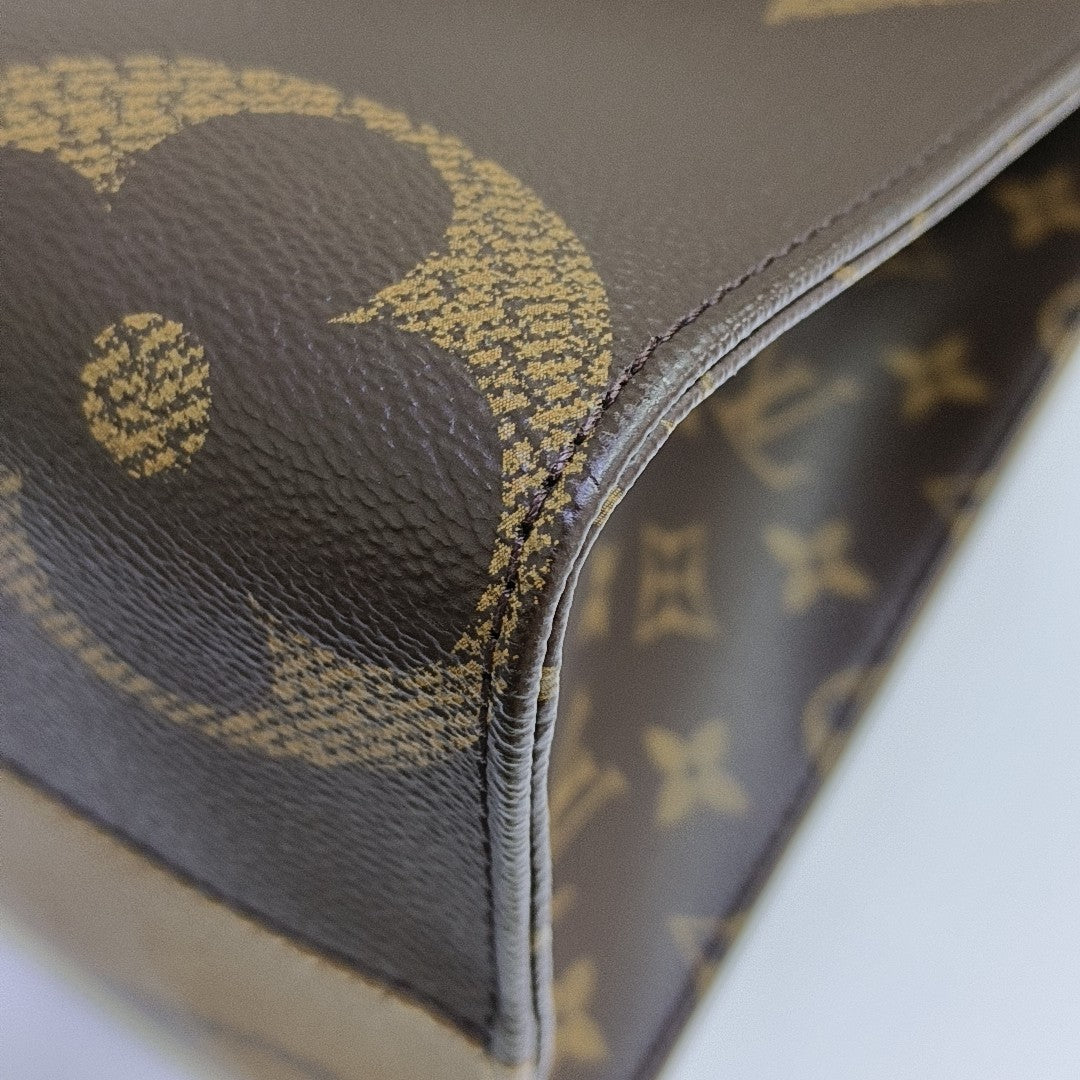 ONTHEGO MM Monogram Coated Canvas Brown