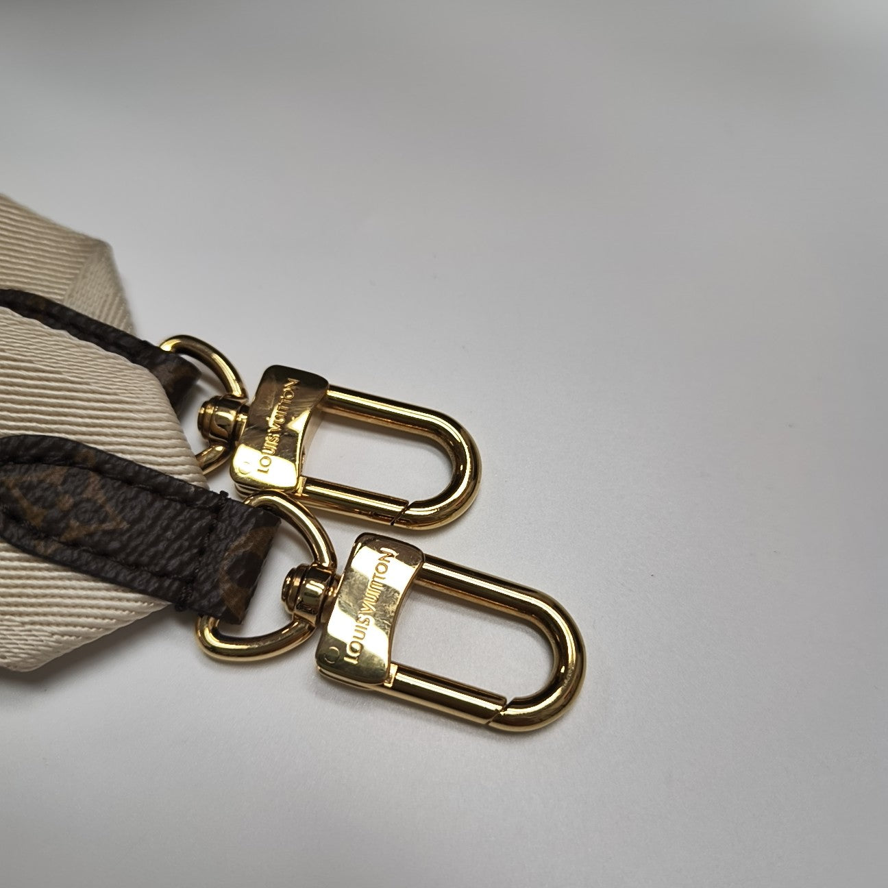 ONTHEGO PM Monogram Coated Canvas Brown