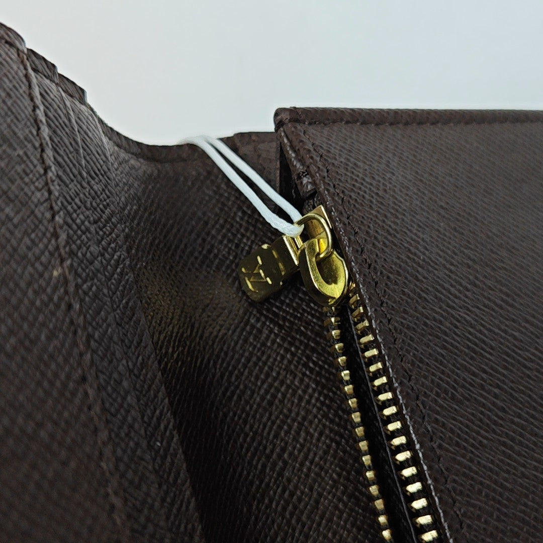 JAMES Damier Ebene Coated Canvas Brown
