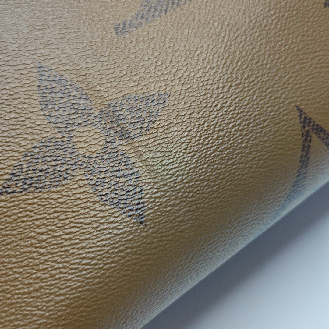 ONTHEGO MM Monogram Coated Canvas Brown