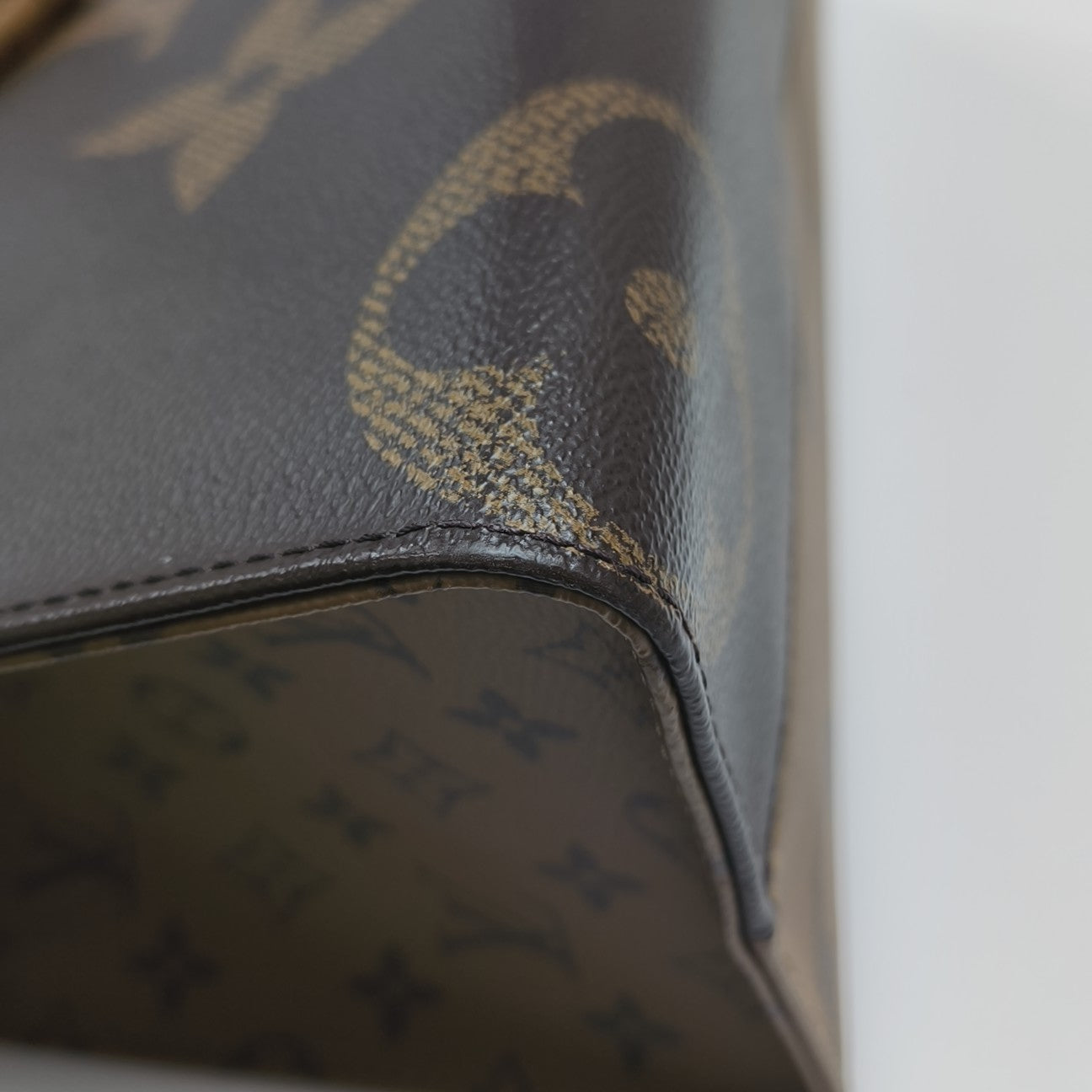 ONTHEGO MM Monogram Coated Canvas Brown