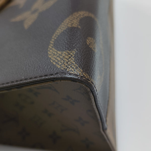 ONTHEGO MM Monogram Coated Canvas Brown