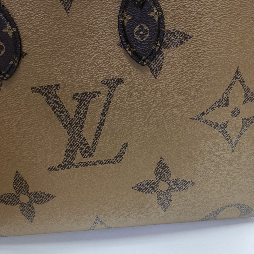 ONTHEGO MM Monogram Coated Canvas Brown