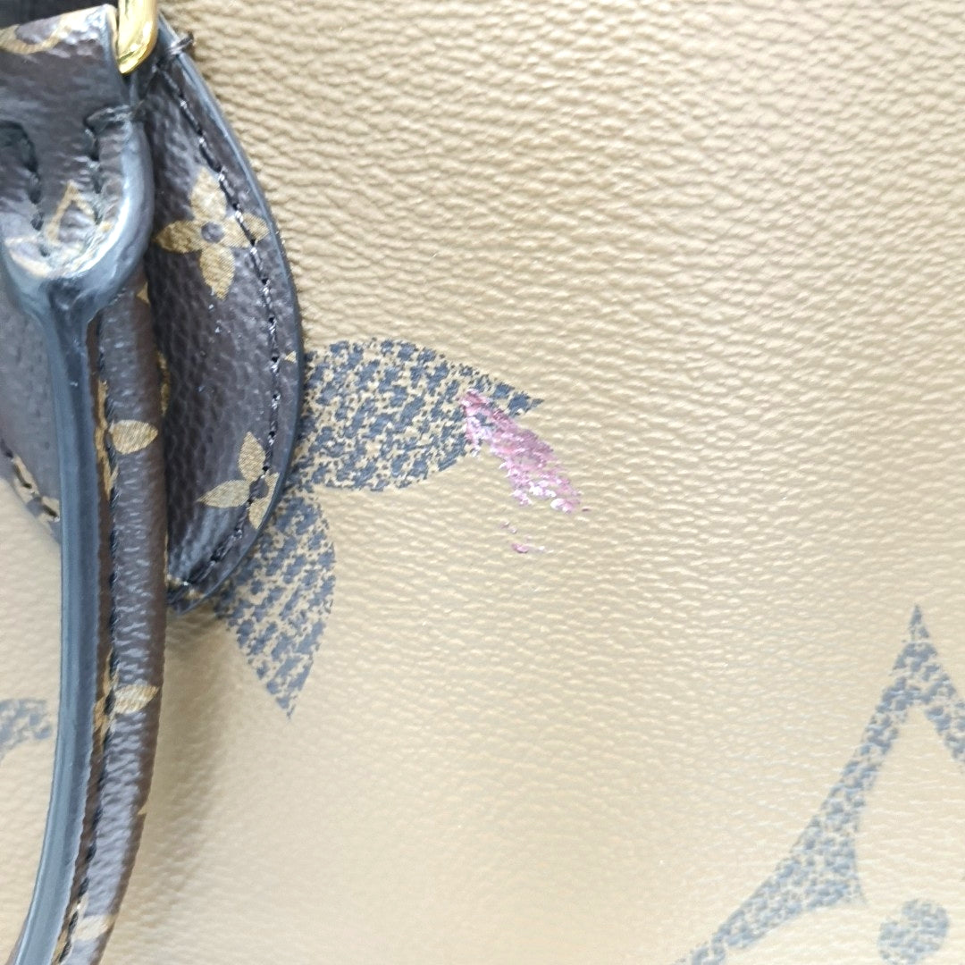 ONTHEGO MM Monogram Coated Canvas Brown