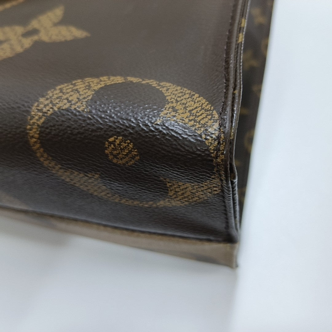 ONTHEGO MM Monogram Coated Canvas Brown