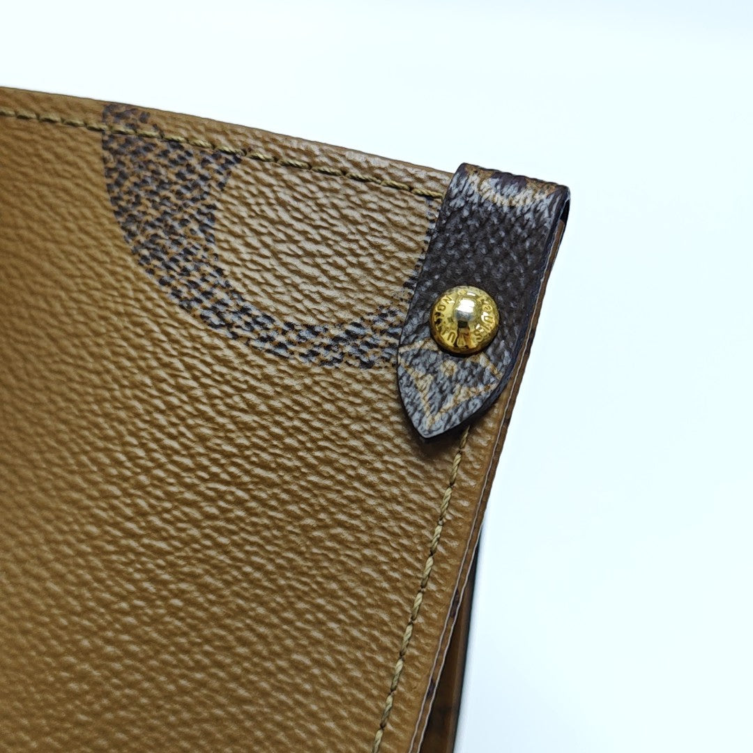 ONTHEGO MM Monogram Coated Canvas Brown