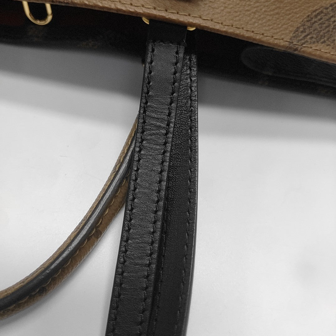 ONTHEGO MM Monogram Coated Canvas Brown