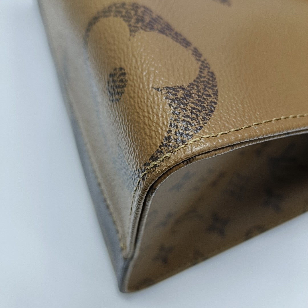 ONTHEGO MM Monogram Coated Canvas Brown