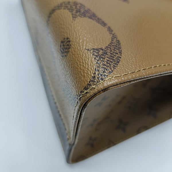 ONTHEGO MM Monogram Coated Canvas Brown
