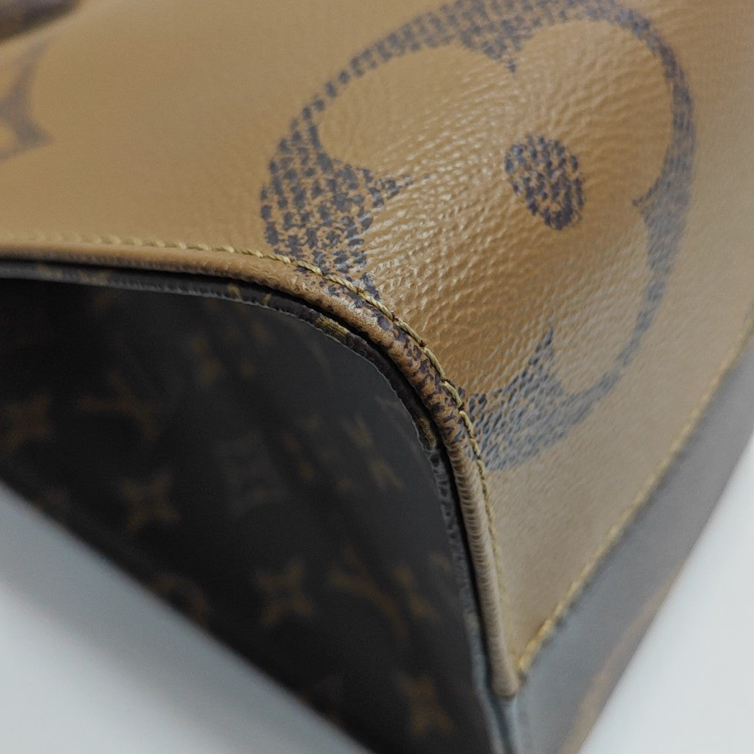 ONTHEGO MM Monogram Coated Canvas Brown