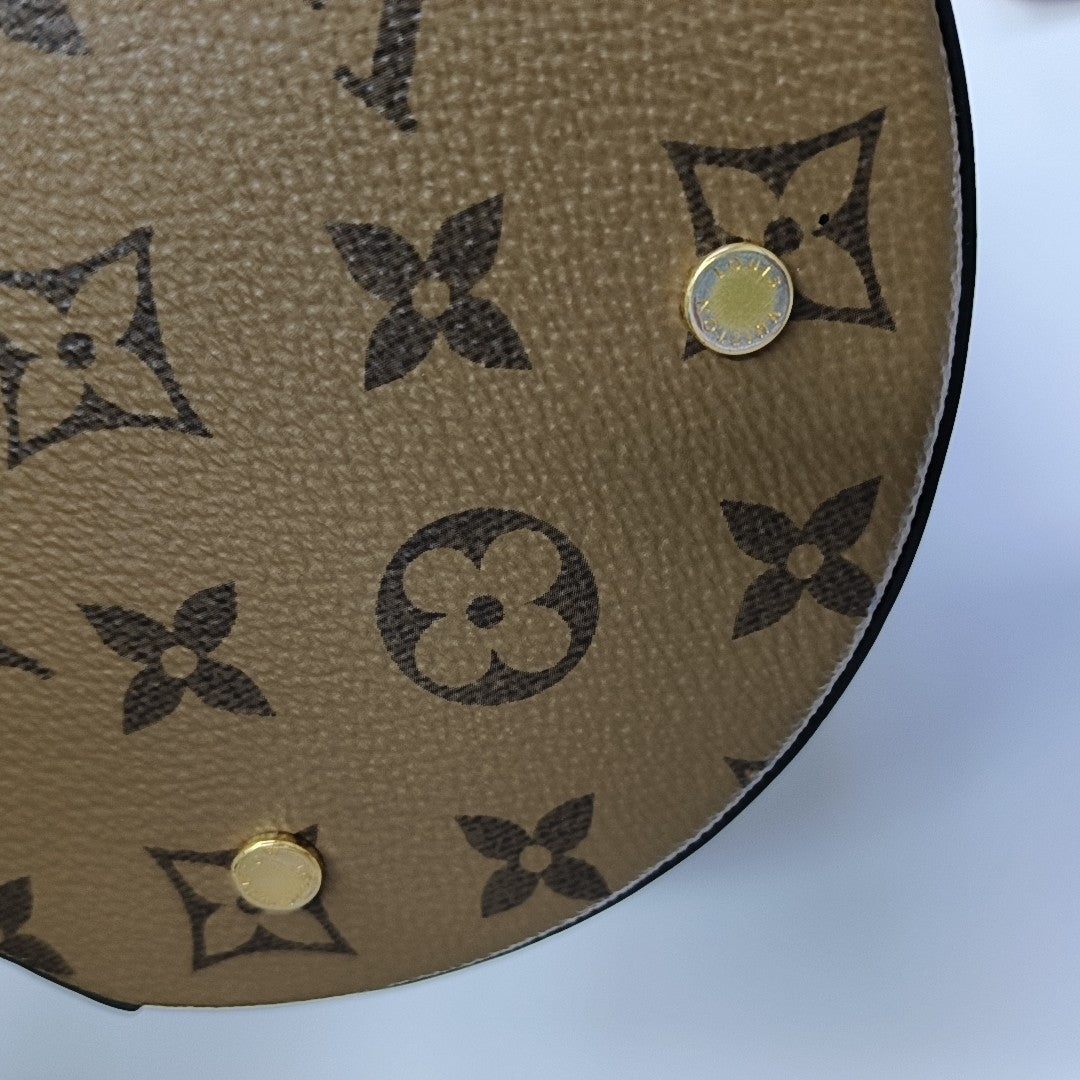 CANNES PM Monogram Coated Canvas Brown
