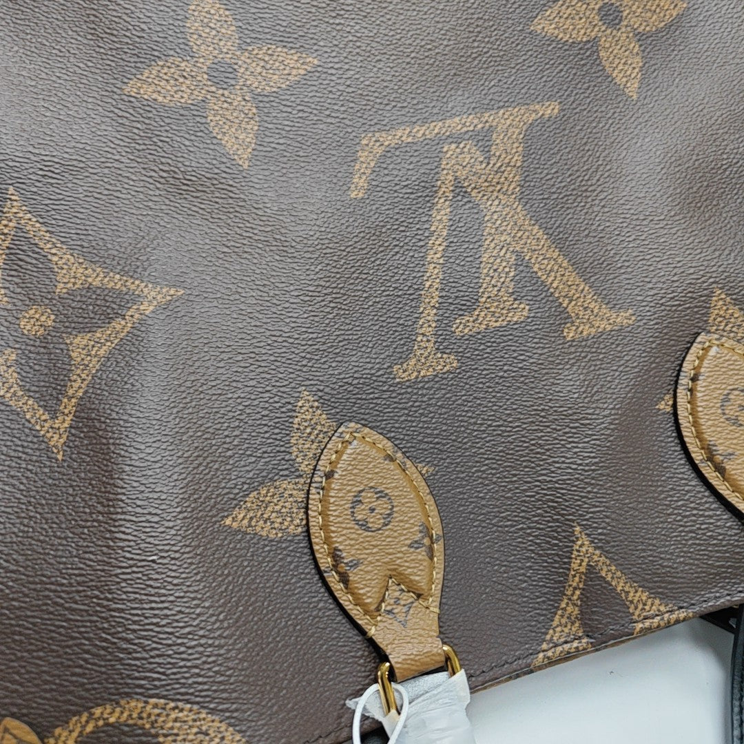 ONTHEGO MM Monogram Coated Canvas Brown