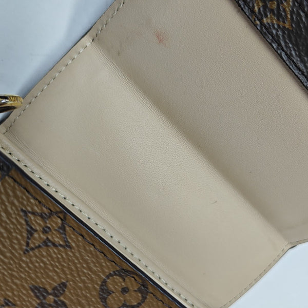 TRUNK Monogram Coated Canvas Brown