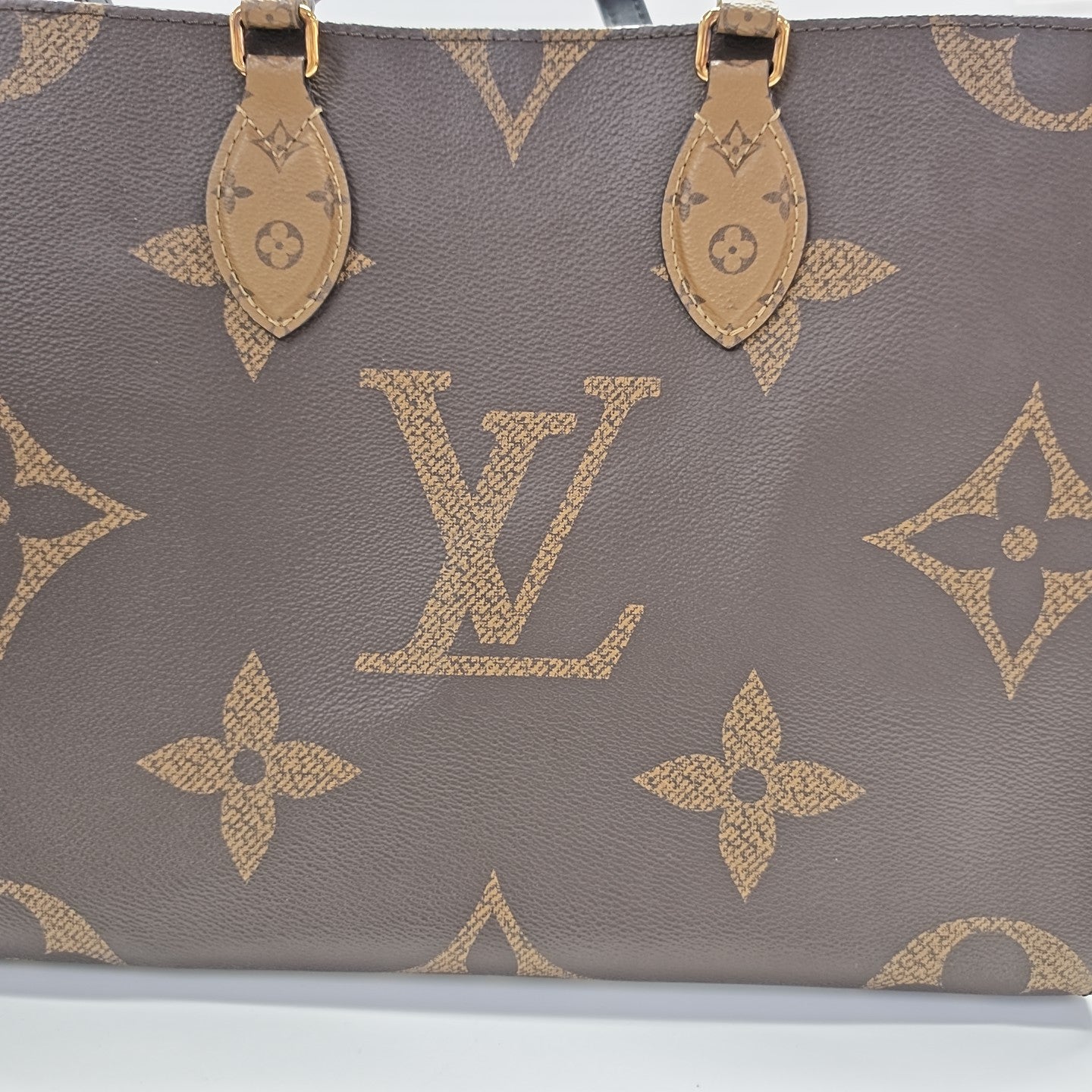 ONTHEGO MM Monogram Coated Canvas Brown