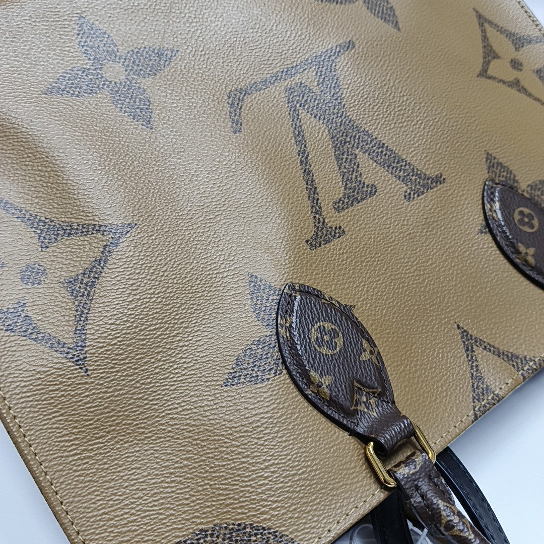 ONTHEGO MM Monogram Coated Canvas Brown