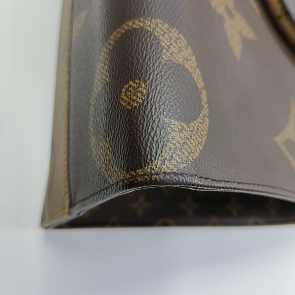 ONTHEGO MM Monogram Coated Canvas Brown