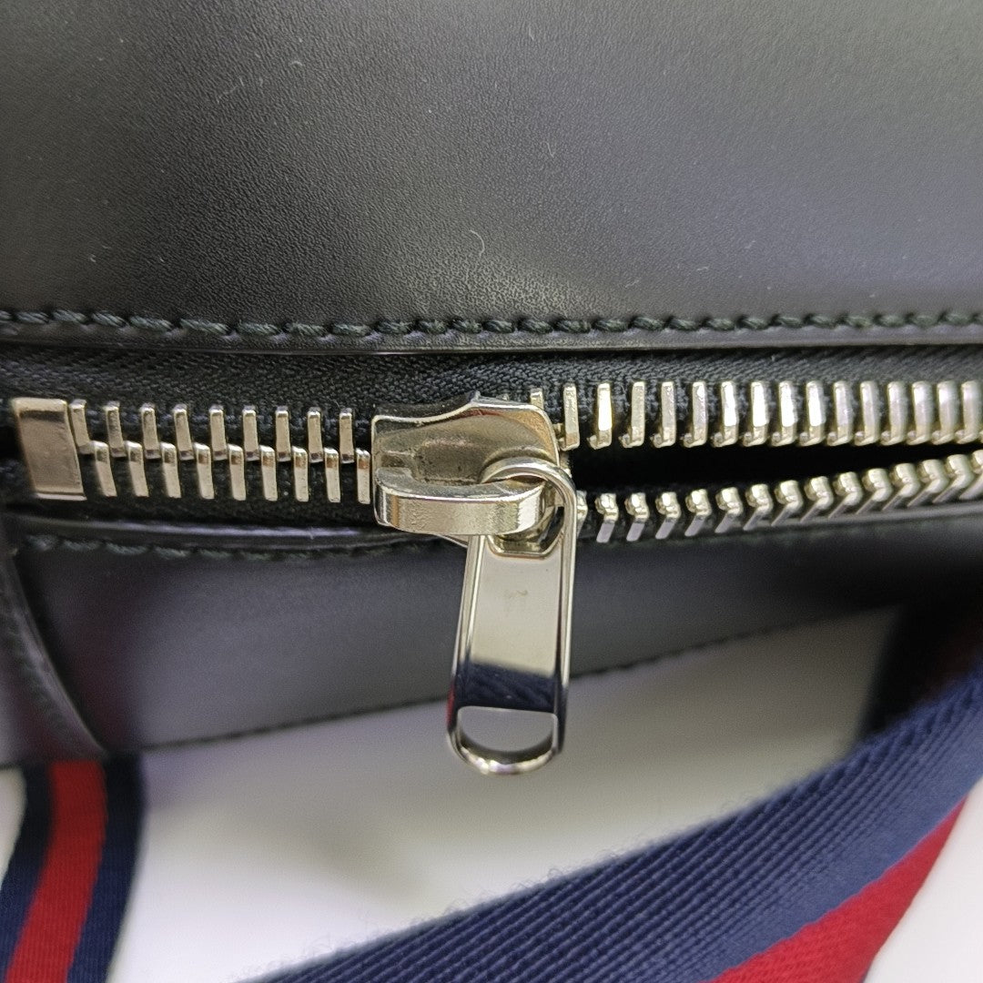 Monogram Coated Canvas Backpack Black