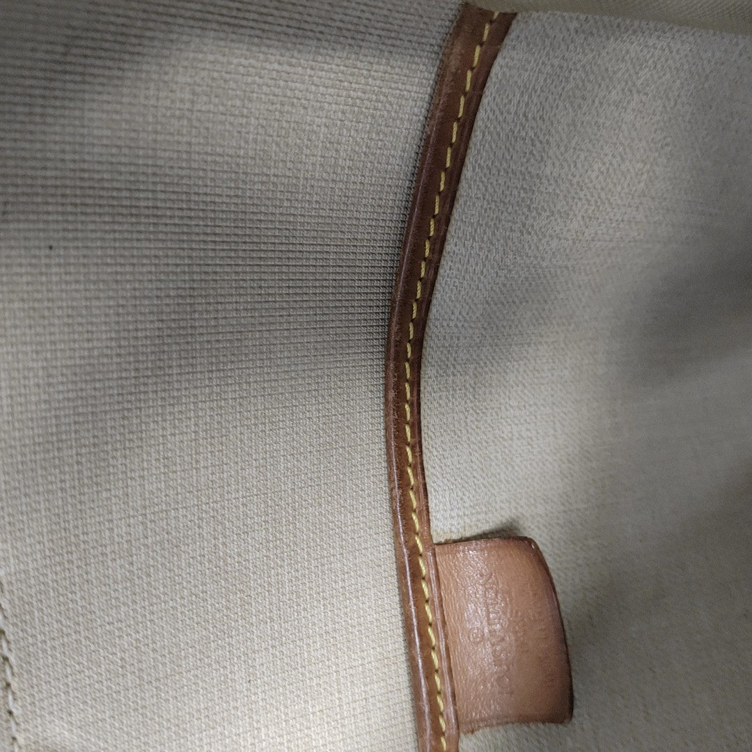 EXCURSION Monogram Coated Canvas Brown