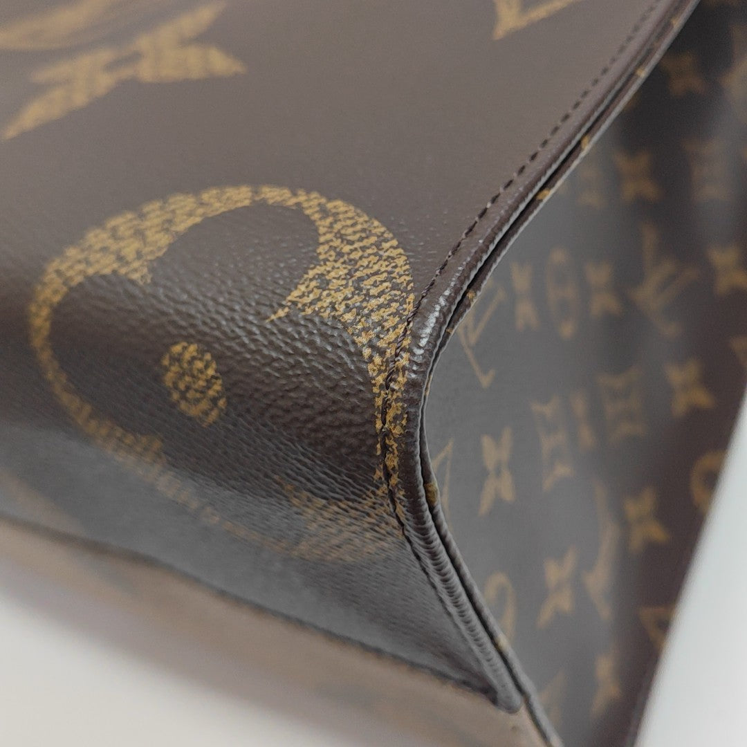ONTHEGO MM Monogram Coated Canvas Brown