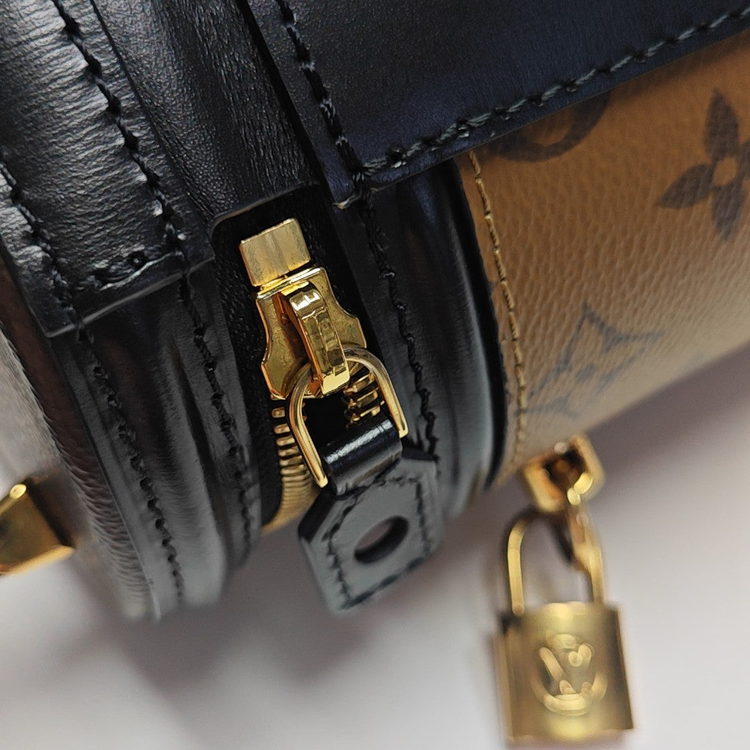 CANNES PM Monogram Coated Canvas Brown