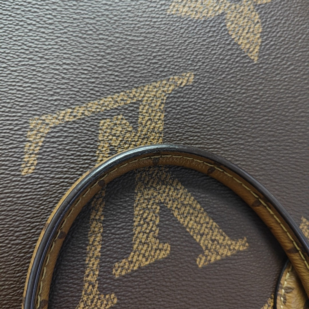 ONTHEGO MM Monogram Coated Canvas Brown