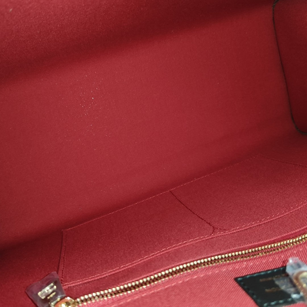 ONTHEGO MM Monogram Coated Canvas Brown