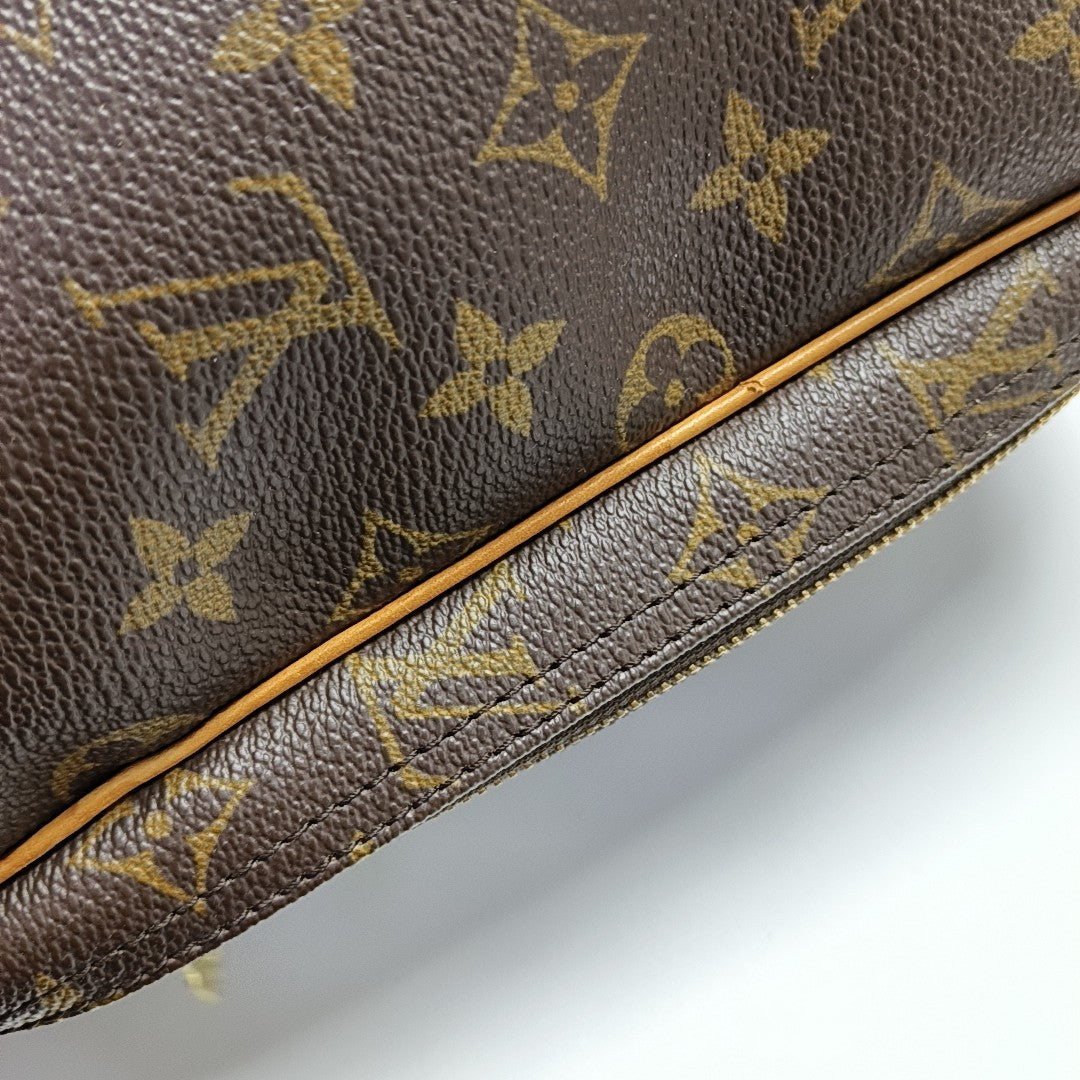 EXCURSION Monogram Coated Canvas Brown