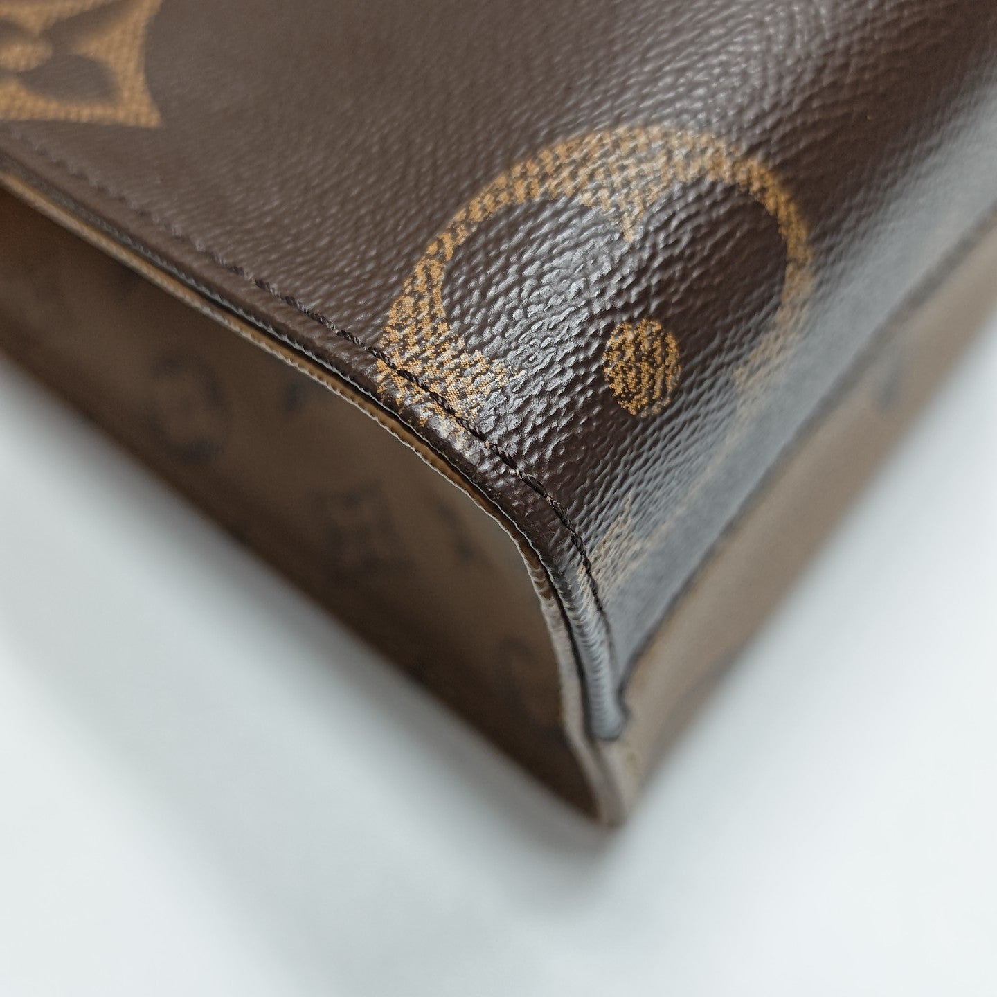 ONTHEGO PM Monogram Coated Canvas Brown