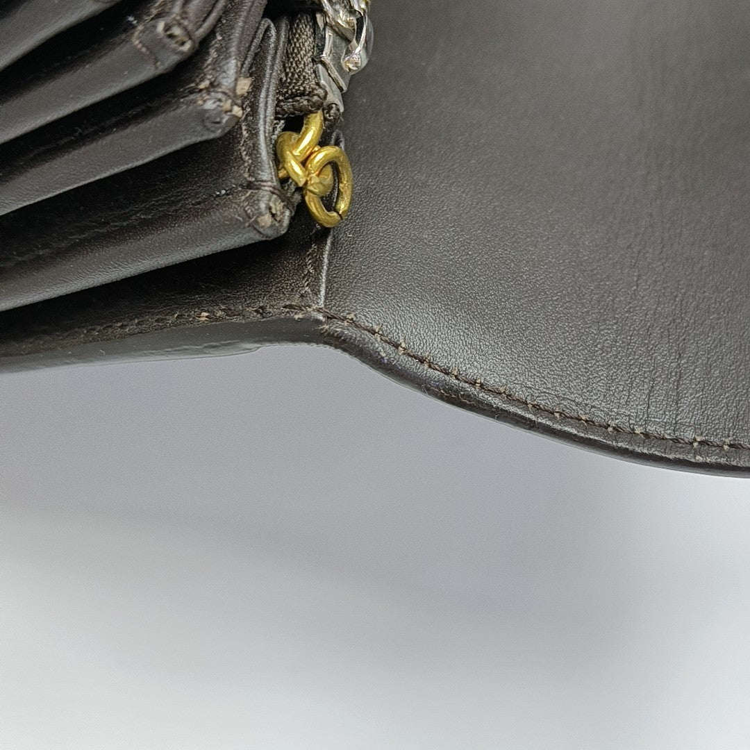 Monogram Coated Canvas Clutch Black