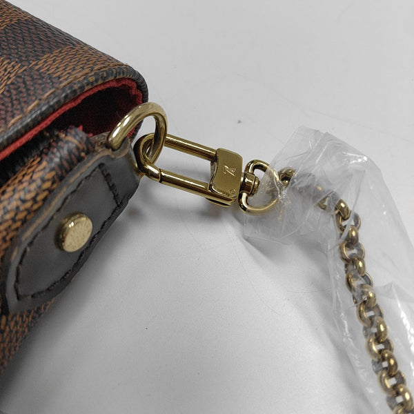 FAVORITE PM Damier Ebene Coated Canvas Brown