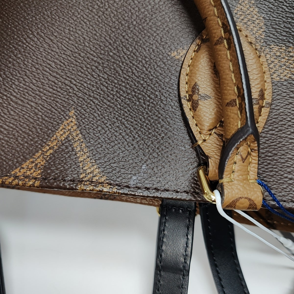 ONTHEGO MM Monogram Coated Canvas Brown