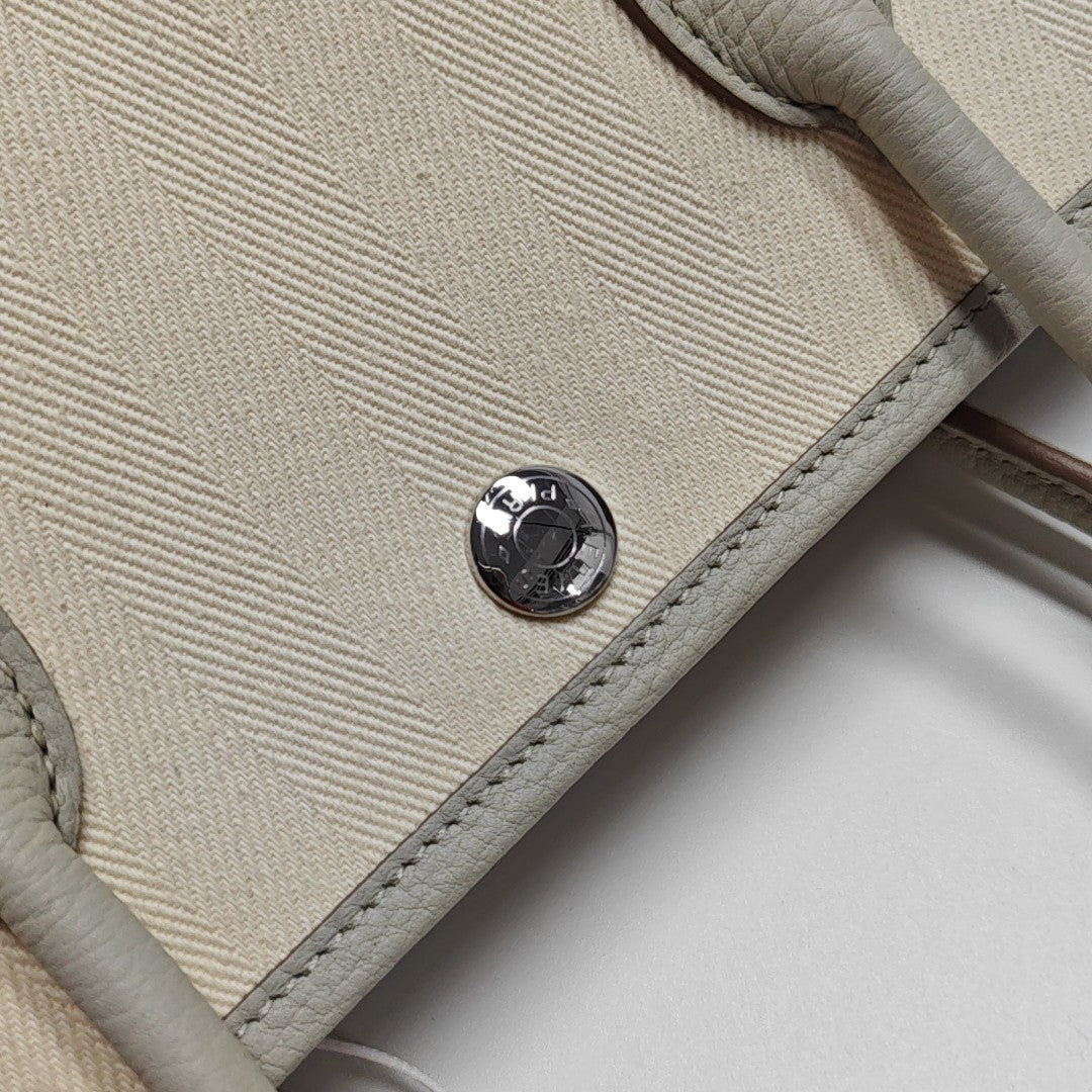 Authenticated pre-owned  Garden Party Canvas White - Top Handle Bag at Looply