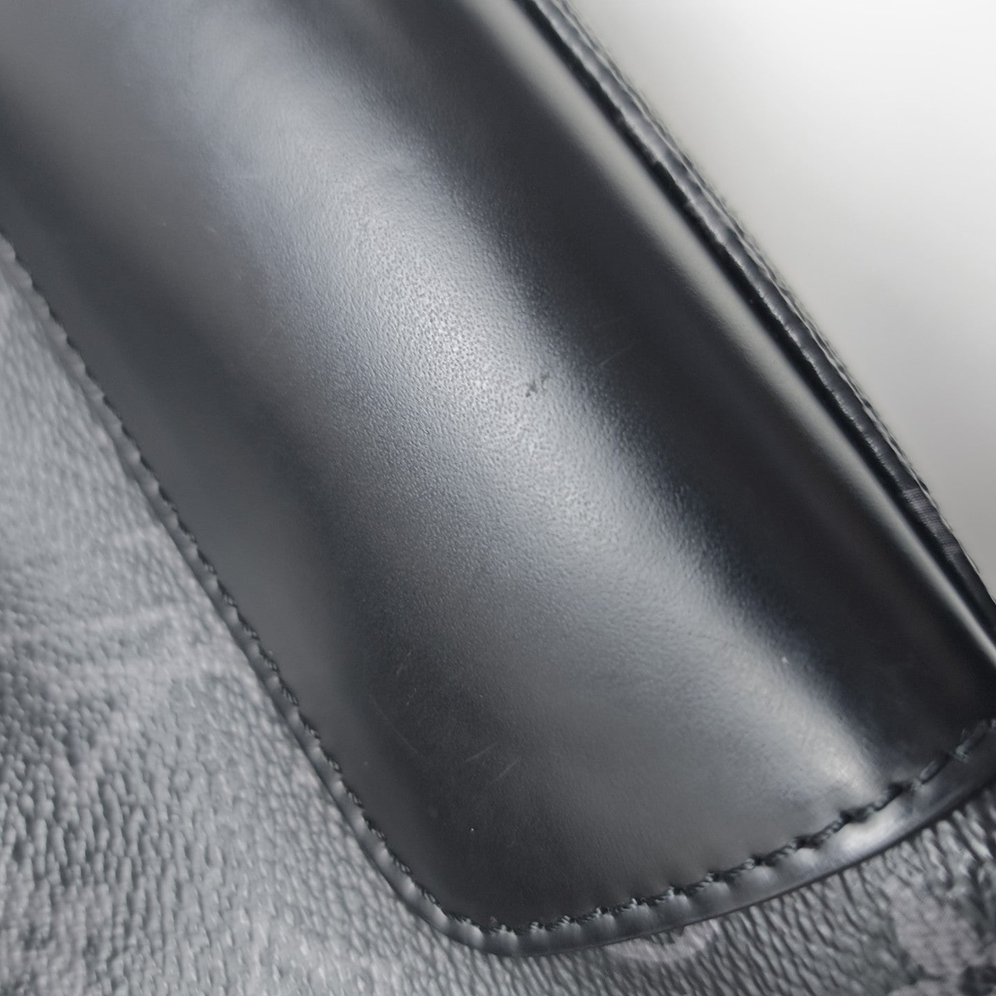 VOYAGER PM Monogram Coated Canvas Black