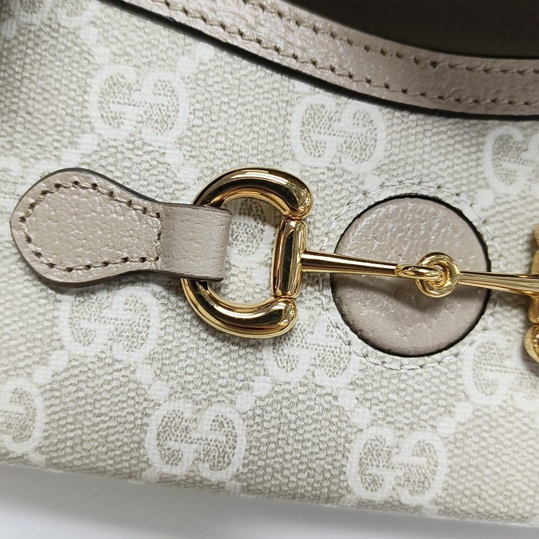 Authenticated pre-owned  Horsebit 1955 Mini Monogram Coated Canvas Beige - Crossbody Bag at Looply
