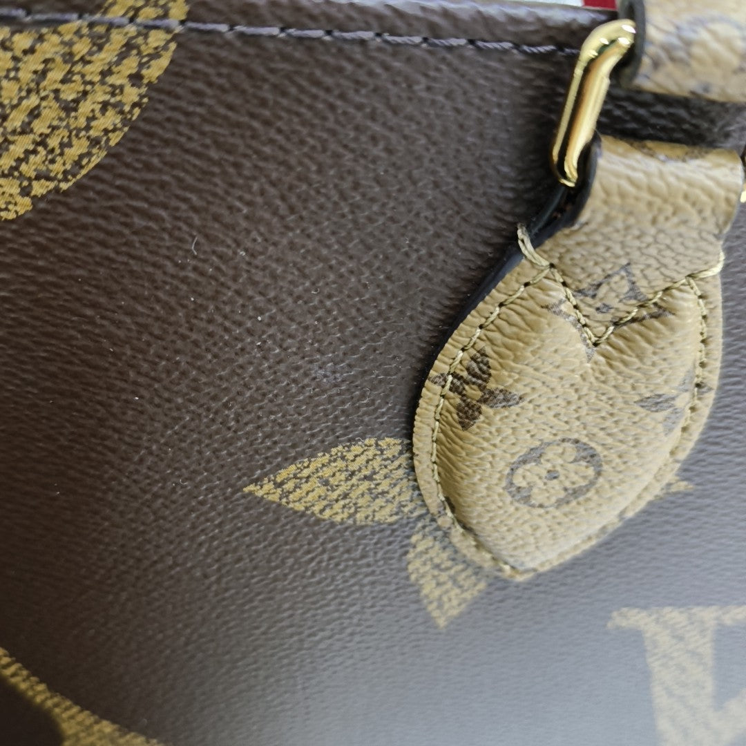 ONTHEGO MM Monogram Coated Canvas Brown